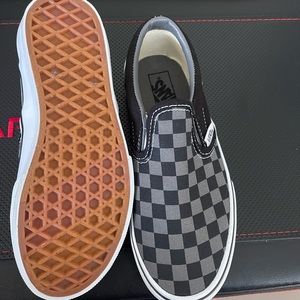 Brand New without box kids size 1.5 checkerboard slip on Vans. Never been worn.